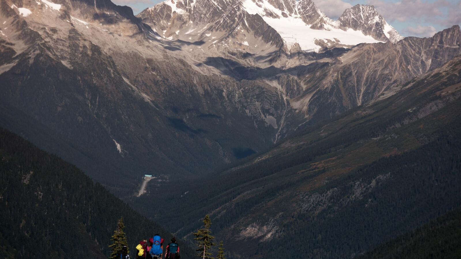 Hikers in Rogers Pass Hikers overlook the vistas of Rogers Pass